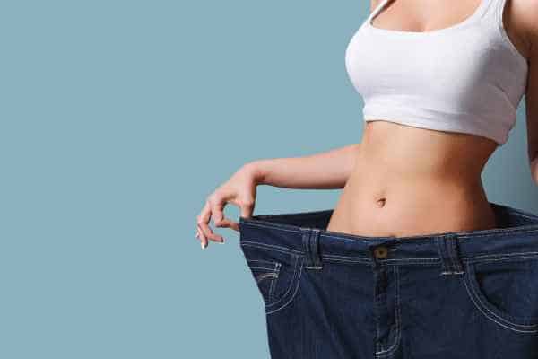 woman after fat reduction treatment Weybridge