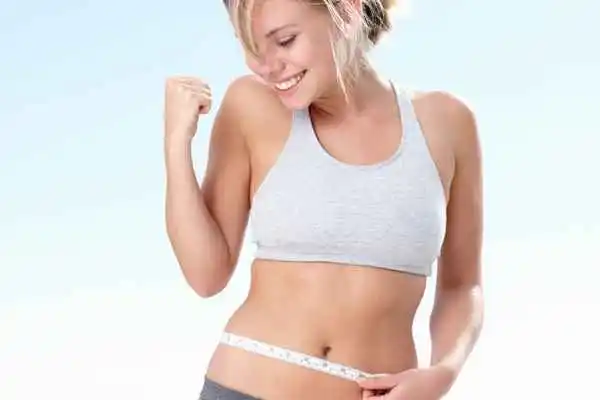 woman happy after fat reduction treatment Weybridge