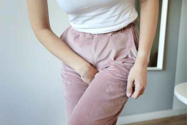 woman struggling with urine incontinence Weybridge